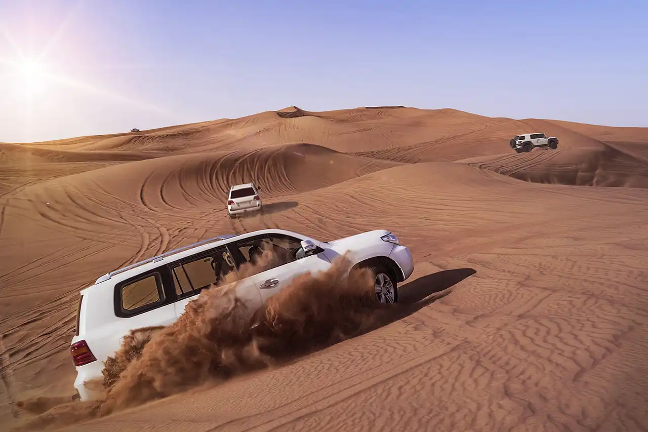 Thrilling dune bashing in Dubai desert during morning safari adventure