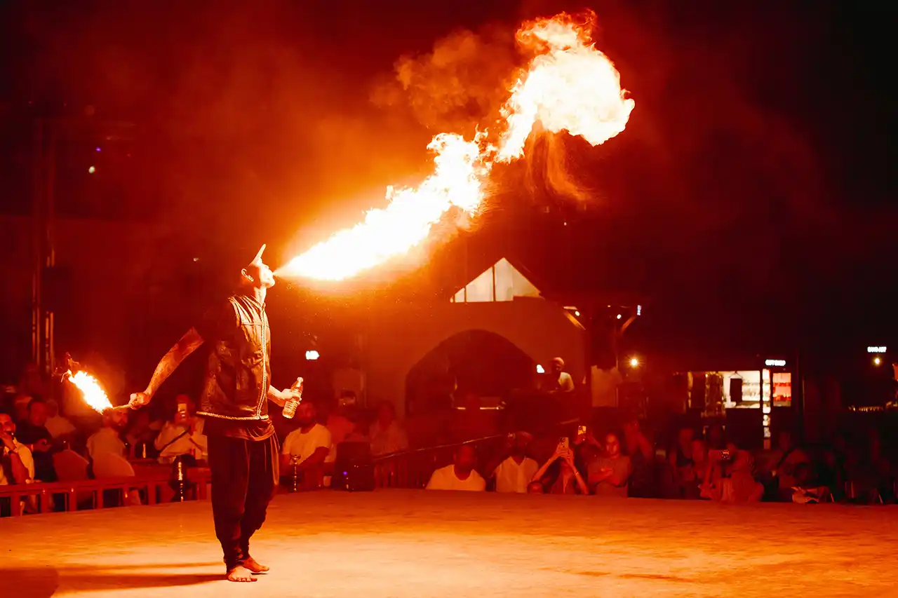 Live fire show performance during an evening desert safari in Dubai