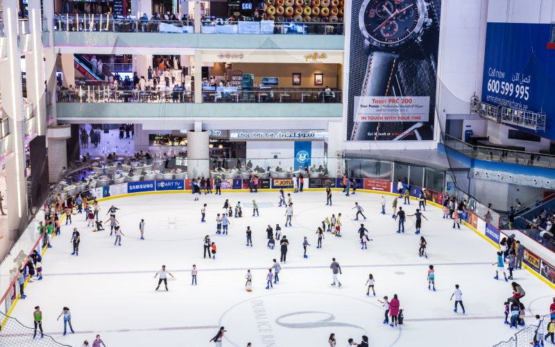 People doing ice skating at ice rink at Dubai mall.