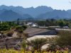 Beautiful Hatta lake with mountains in the background .