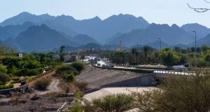 Beautiful Hatta lake with mountains in the background .